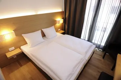 Ein Bett oder Betten in einem Zimmer der Unterkunft Hotel Thalmair