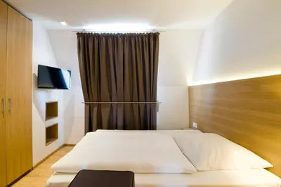 Ein Bett oder Betten in einem Zimmer der Unterkunft Hotel Thalmair