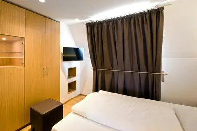 Ein Bett oder Betten in einem Zimmer der Unterkunft Hotel Thalmair