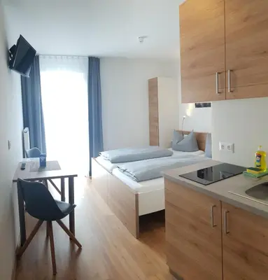 Ein Bett oder Betten in einem Zimmer der Unterkunft easy sleep Apartmenthotel