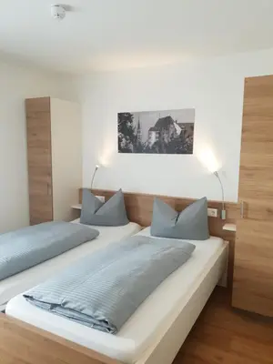 Ein Bett oder Betten in einem Zimmer der Unterkunft easy sleep Apartmenthotel