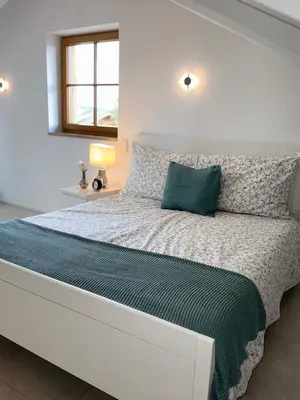 Ein Bett oder Betten in einem Zimmer der Unterkunft Ferienwohnung Siglreitmaier