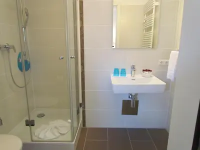 Ein Badezimmer in der Unterkunft AMENITY-Garden-Apartments
