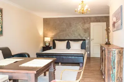 Ein Bett oder Betten in einem Zimmer der Unterkunft Alpen Deluxe Oberammergau