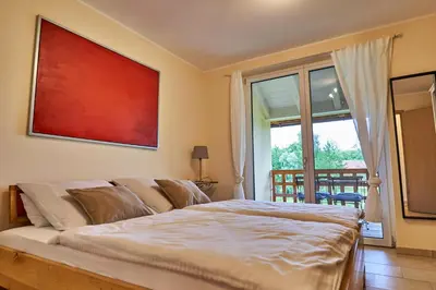 Ein Bett oder Betten in einem Zimmer der Unterkunft Ferienwohnungen Gut Mischenried
