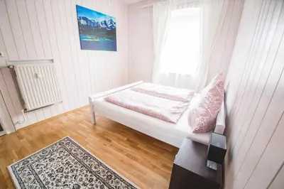 Ein Bett oder Betten in einem Zimmer der Unterkunft Ferienwohnung Alpi