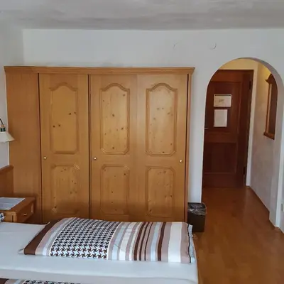 Ein Bett oder Betten in einem Zimmer der Unterkunft Lenggrieser Hof
