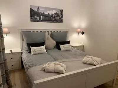 Ein Bett oder Betten in einem Zimmer der Unterkunft Ferienwohnung Schmetterer