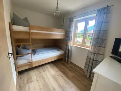 Ein Bett oder Betten in einem Zimmer der Unterkunft Ferienwohnung Schmetterer