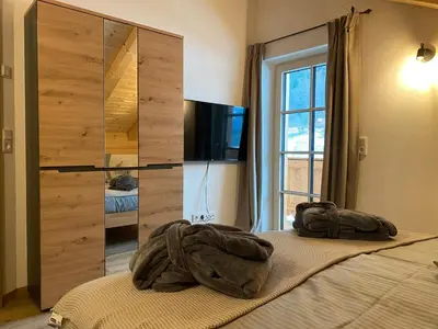 Ein Bett oder Betten in einem Zimmer der Unterkunft Ferienwohnung Schmetterer