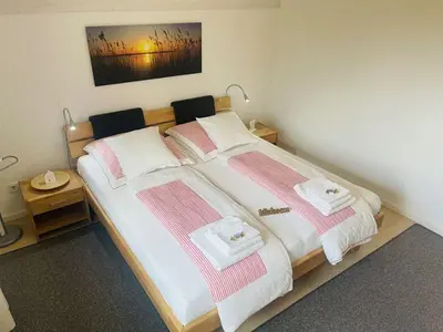 Ein Bett oder Betten in einem Zimmer der Unterkunft Ferienwohnung Hoherting