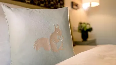 Ein Bett oder Betten in einem Zimmer der Unterkunft Parkhotel Rothof