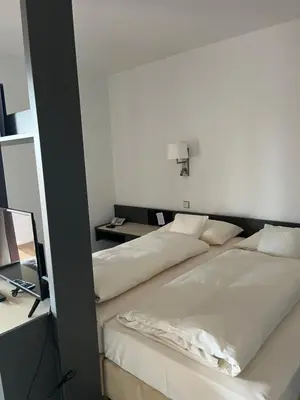 Ein Bett oder Betten in einem Zimmer der Unterkunft Hotel Gasthof Seefelder Hof