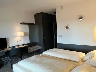Ein Bett oder Betten in einem Zimmer der Unterkunft Hotel Gasthof Seefelder Hof
