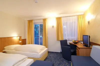 Ein Bett oder Betten in einem Zimmer der Unterkunft Hotel Gasthof Seefelder Hof