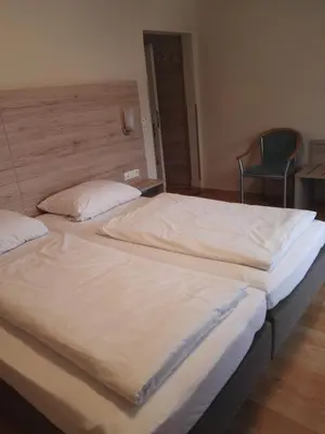 Ein Bett oder Betten in einem Zimmer der Unterkunft Hotel Gasthof Momm