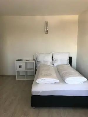 Ein Bett oder Betten in einem Zimmer der Unterkunft Pension Stamperl Bar