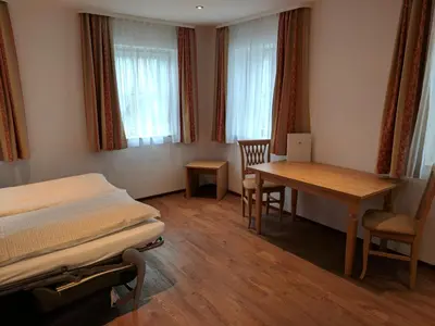Ein Bett oder Betten in einem Zimmer der Unterkunft Gasthaus Weingast
