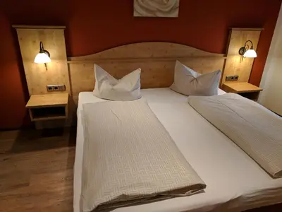 Ein Bett oder Betten in einem Zimmer der Unterkunft Gasthaus Weingast
