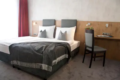 Ein Bett oder Betten in einem Zimmer der Unterkunft Boardinghouse Landshut