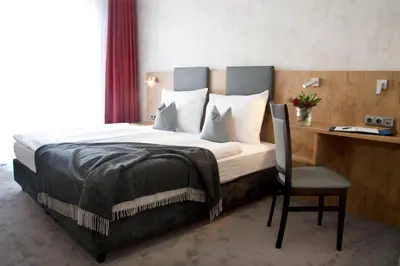 Ein Bett oder Betten in einem Zimmer der Unterkunft Boardinghouse Landshut