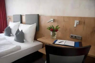 Ein Bett oder Betten in einem Zimmer der Unterkunft Boardinghouse Landshut