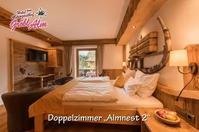 Ein Bett oder Betten in einem Zimmer der Unterkunft Gröbl-Alm