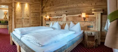 Ein Bett oder Betten in einem Zimmer der Unterkunft Gröbl-Alm