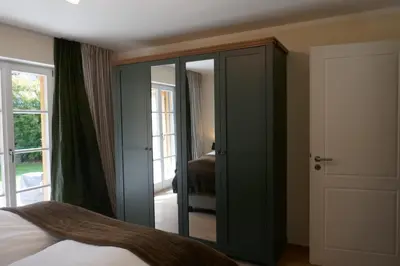 Ein Bett oder Betten in einem Zimmer der Unterkunft Bodenschneid Suiten Rottach-Egern
