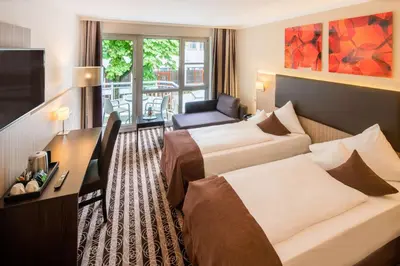 Ein Bett oder Betten in einem Zimmer der Unterkunft Best Western Plus Parkhotel Erding