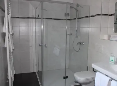 Ein Badezimmer in der Unterkunft Hotel Alex