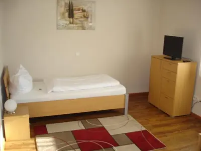 Ein Bett oder Betten in einem Zimmer der Unterkunft Hotel Alex