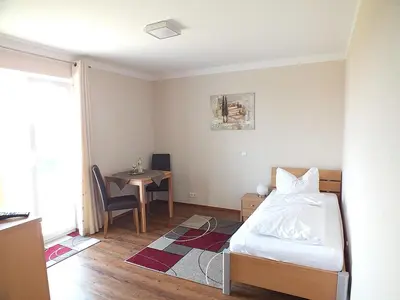 Ein Bett oder Betten in einem Zimmer der Unterkunft Hotel Alex