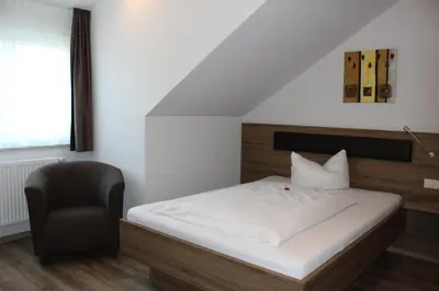 Ein Bett oder Betten in einem Zimmer der Unterkunft Hotel Alex