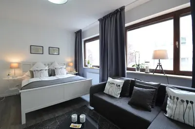 Ein Bett oder Betten in einem Zimmer der Unterkunft Munich Aparthotel