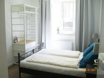 Ein Bett oder Betten in einem Zimmer der Unterkunft Munich Aparthotel