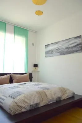 Ein Bett oder Betten in einem Zimmer der Unterkunft Yeti Lux - Central City Loft