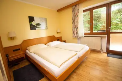Ein Bett oder Betten in einem Zimmer der Unterkunft Hotel am Wald