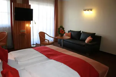 Ein Bett oder Betten in einem Zimmer der Unterkunft Apparthotel Garni Superior Simsseeblick