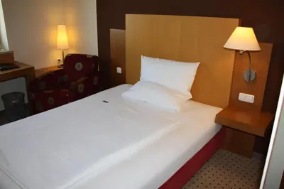 Ein Bett oder Betten in einem Zimmer der Unterkunft Pension Geno