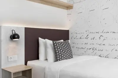Ein Bett oder Betten in einem Zimmer der Unterkunft Stellaris Apartment Hotel