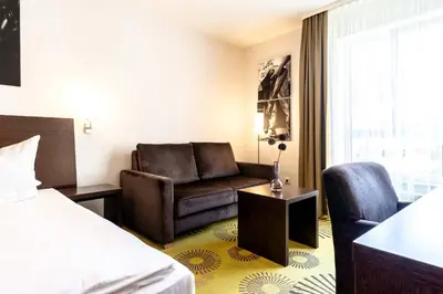 Ein Bett oder Betten in einem Zimmer der Unterkunft Altstadthotel Guesthouse Die Galerie