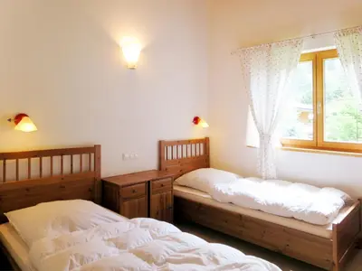 Ein Bett oder Betten in einem Zimmer der Unterkunft Holiday Home Chalet Walchsee by Interhome