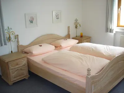 Ein Bett oder Betten in einem Zimmer der Unterkunft Ferienwohnanlage Partnach