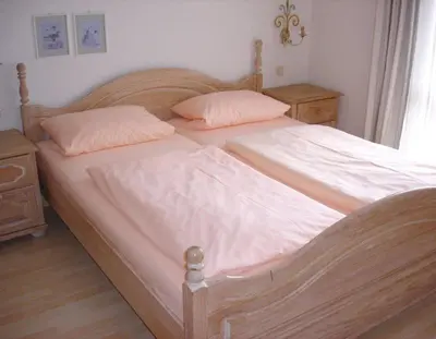 Ein Bett oder Betten in einem Zimmer der Unterkunft Ferienwohnanlage Partnach