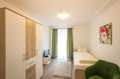 Ein Bett oder Betten in einem Zimmer der Unterkunft Ferienhaus Villa Alpenpanorama