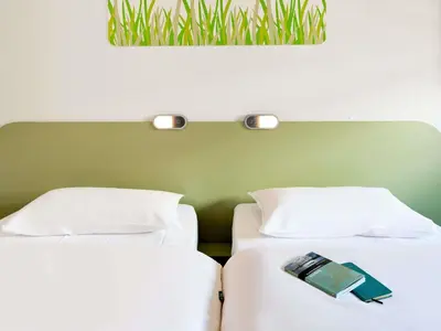 Ein Bett oder Betten in einem Zimmer der Unterkunft ibis budget Muenchen Ost Messe