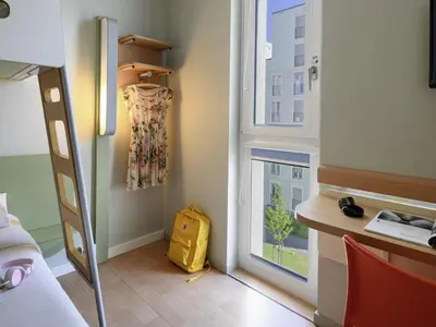 Ein Bett oder Betten in einem Zimmer der Unterkunft ibis budget Muenchen City Olympiapark