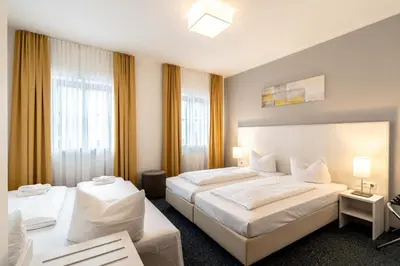 Ein Bett oder Betten in einem Zimmer der Unterkunft Hotel Wandinger Hof