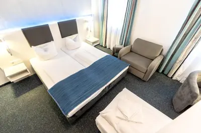 Ein Bett oder Betten in einem Zimmer der Unterkunft Hotel Wandinger Hof